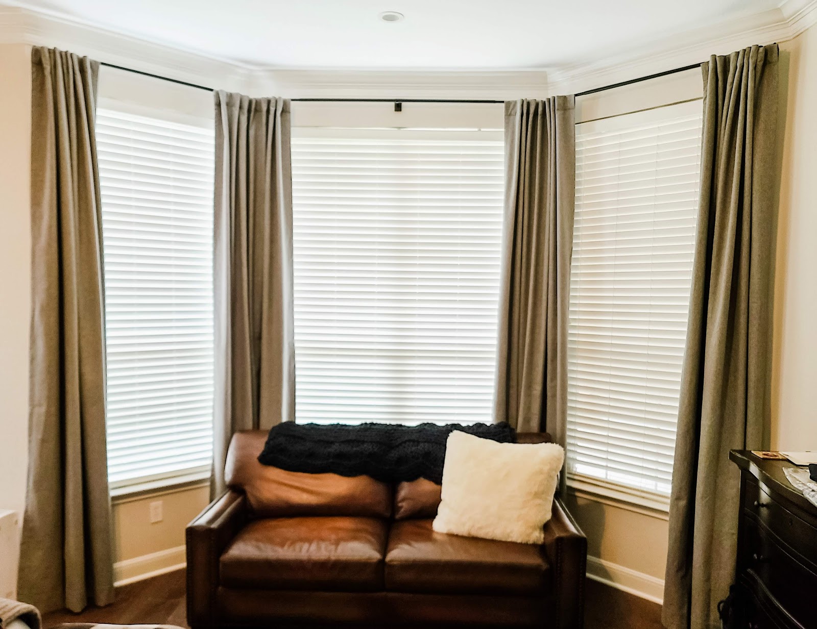 Curtain rod installation in Belton home